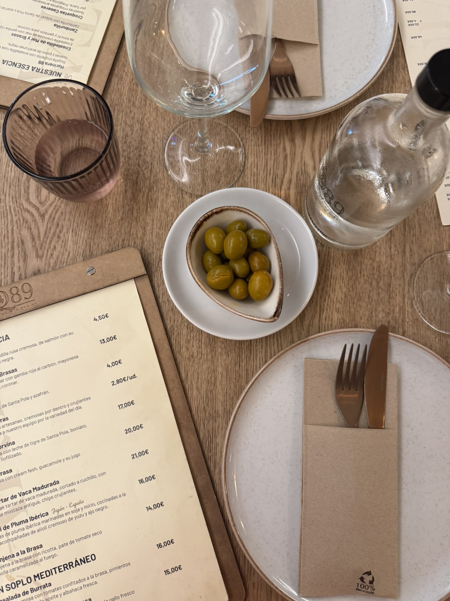 Table setting with olives and menu